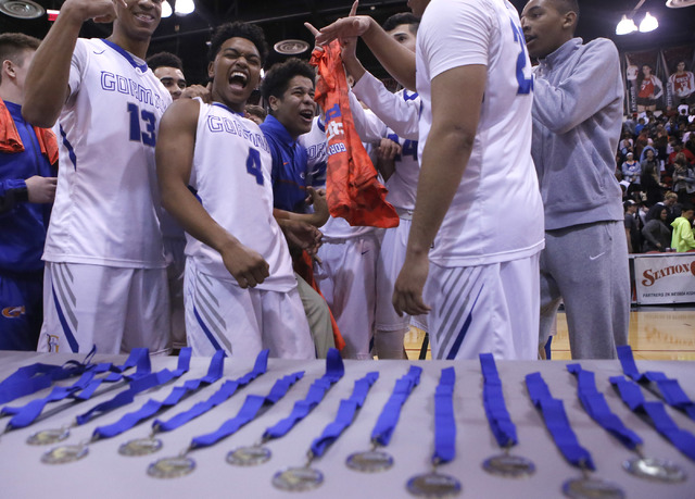 Bishop Gorman’s players react after winning a Class 4A boys state final championship g ...