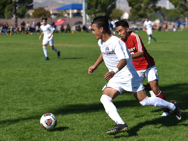 Coronado’s Lincoln Aquino (24) dribbles the ball against Valley during the Sunrise reg ...