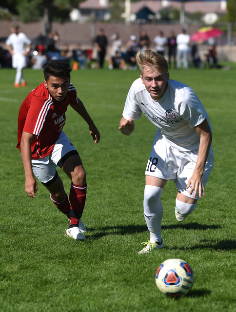 Coronado’s Patrick Komanowski (18) battles for the ball against Valley’s Joseph ...