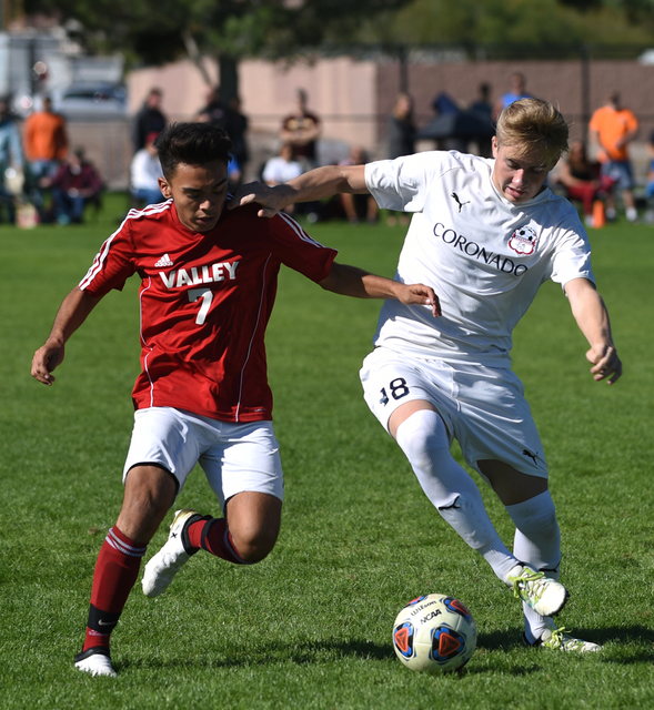 Coronado’s Patrick Komanowski (18) battles for the ball against Valley’s Joseph ...