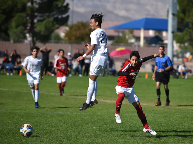 Coronado’s Lincoln Aquino (24) battles for the ball against Valley’s Antonio Agu ...