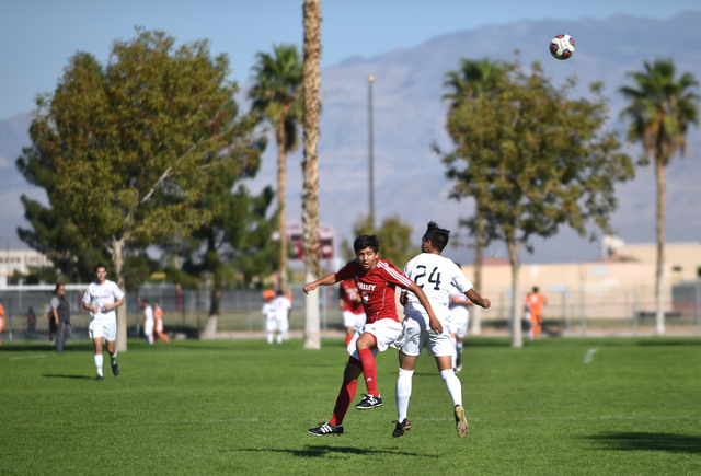 Coronado’s Lincoln Aquino (24) battles for the ball against Valley’s Efren Moren ...