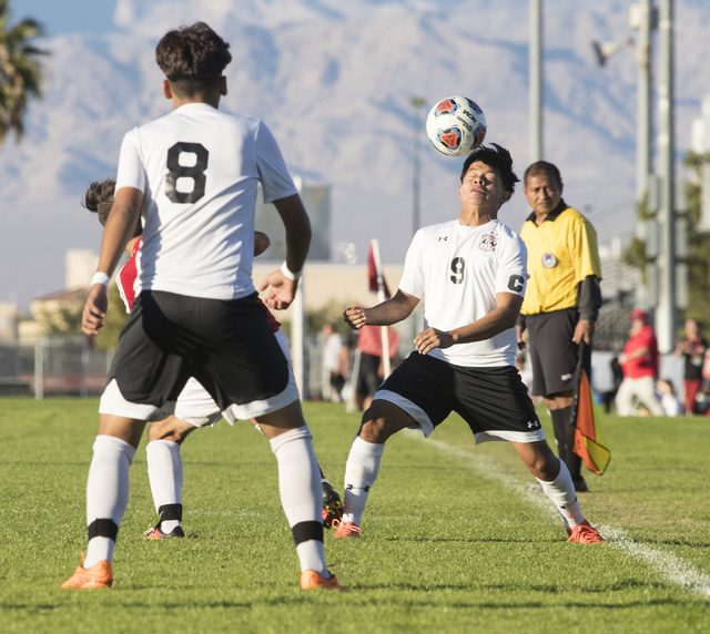 Alejandro RIvera (9), from Las Vegas High School, heads the ball during the Sunrise Region b ...