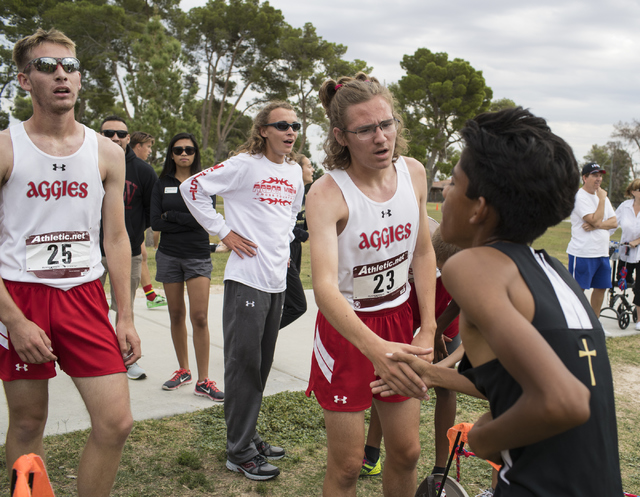 Second place winner Ian Jackson, center congratulates another player while Tim Myers, left, ...