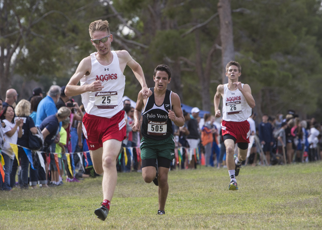 Tim Myers, from left, Evelio Vergara and Andrew Parker race to the finish line during the Re ...