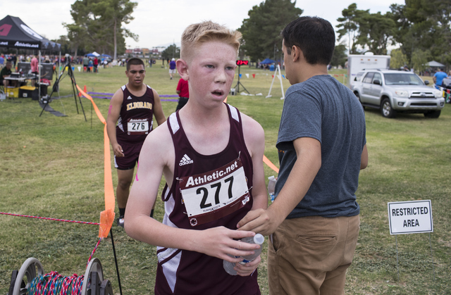 Ivan Olivares, right, congratulates Jacob Hook and Oscar Esparza for completing the race at ...