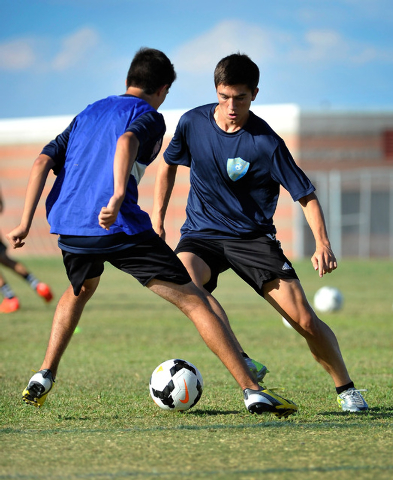 Foothill forward Robert Cowan, right, looks to get around defender Zeke Garcia during a rece ...