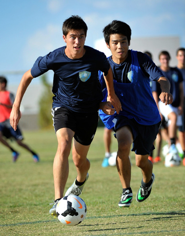 Foothill forward Robert Cowan, left, gets by defender Ammon Okazaki during practice. (Photo ...