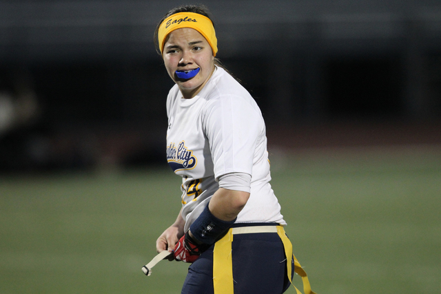 Boulder City quarterback Jeanne Carmell (14) reacts during a play in their flag football gam ...