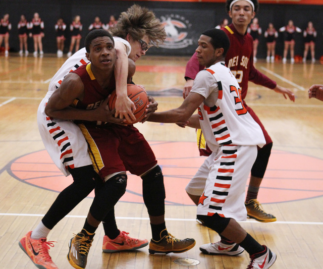 Del Sol’s Jonathan Spearman fights for a lose ball with Chaparral’s Ben Kirschba ...