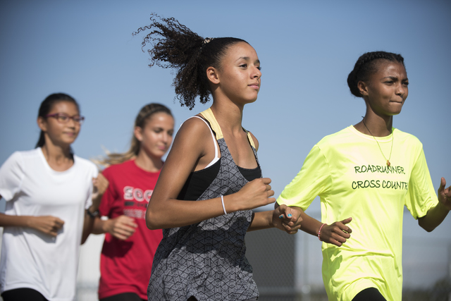 Freshman Diamond Morris, center, 14, runs during cross country practice at Southeast Career ...