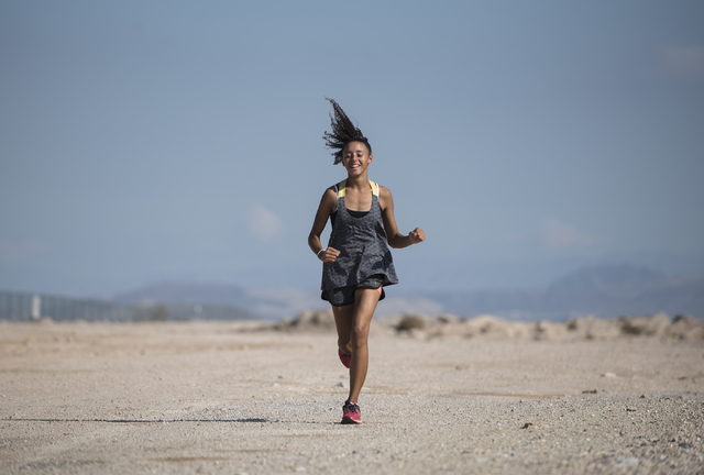 Freshman Diamond Morris, 14, runs during cross country practice at Southeast Career Technica ...