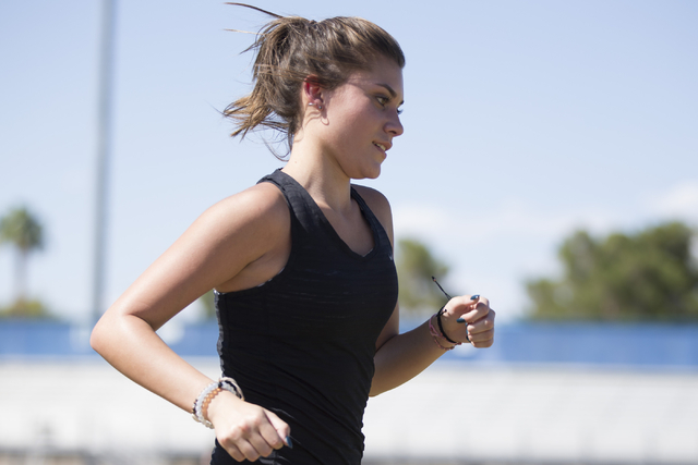 Green Valley cross country runner Mia Smith, 15, runs during a team practice at Green Valley ...