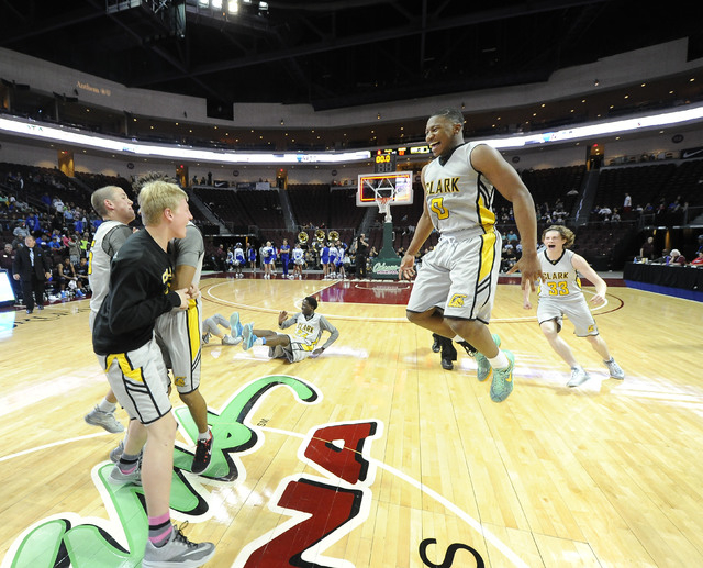 Clark players celebrate their 62-46 win over Desert Pines during the Division I-A boys state ...