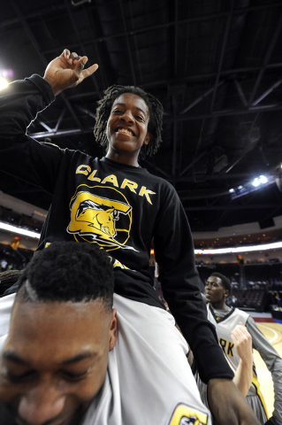 Clark sophomore point guard Nick Davis is hoisted on the shoulders of senior guard Colby Jac ...