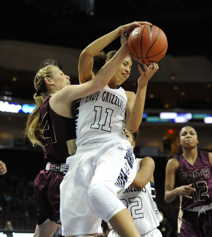 Spring Valley guard Kayla Harris (11) grabs a defensive rebound against Faith Lutheran forwa ...