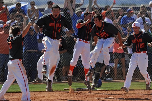 Bishop Gorman players celebrate Cadyn Grenier’s walk-off home run in the ninth inning ...