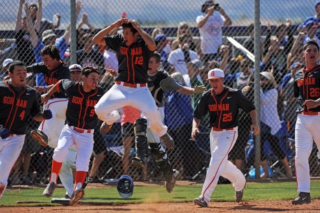 Bishop Gorman players celebrate Cadyn Grenier’s walk-off home run in the ninth inning ...