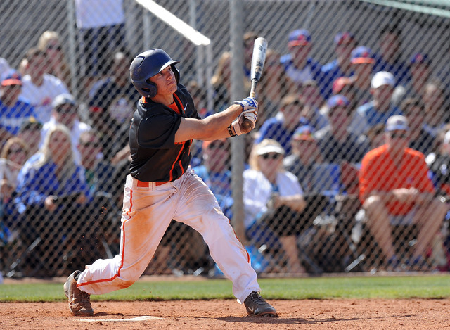 Bishop Gorman shortstop Gadyn Grenier (2) hits a walk-off home run against Green Valley in t ...