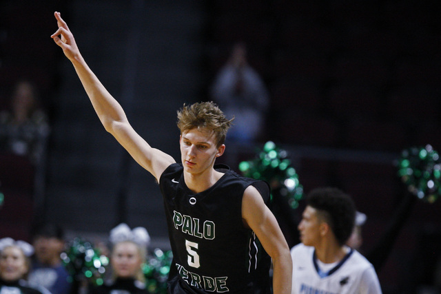 Palo Verde forward Grant Dressler signals a successful 3-point shot against Canyon Springs d ...