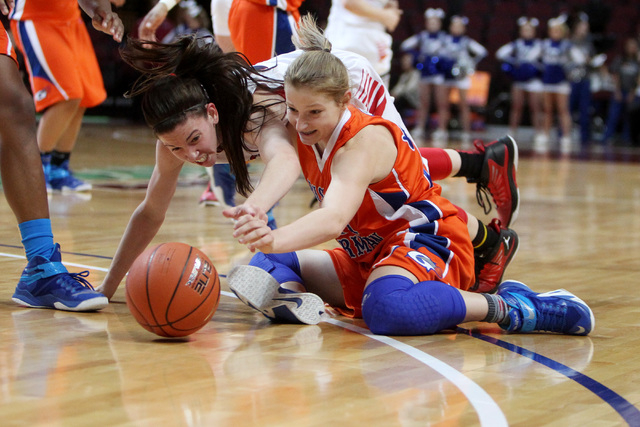 Liberty guard Kealy Brown and Bishop Gorman guard Samantha Coleman scramble for a loose ball ...