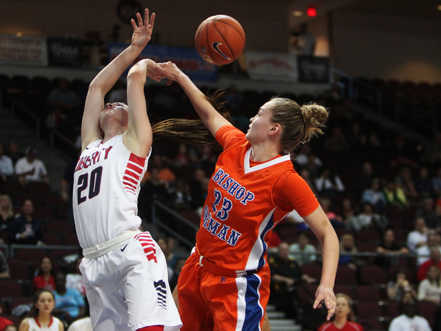 Bishop Gorman guard Megan Jacobs fouls Liberty guard Kealy Brown during their Division I sta ...