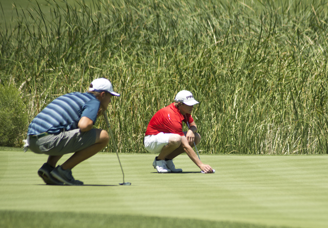 Shadow Ridge’s Tanner Johnson watches as Arbor View’s Sam Dickey places his ball ...