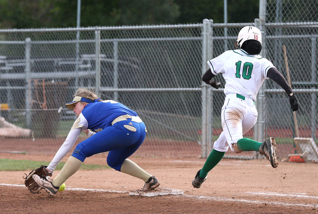 Rancho’s Jahnae Davis-Houston reaches first base as Reed’s Alexis Gonzalez tries ...