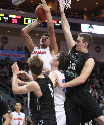 Bishop Gorman center Chase Jeter drives to the basket against Palo Verde during their Divisi ...