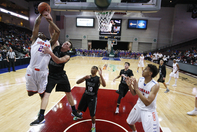 Bishop Gorman forward Nick Blair is fouled by Palo Verde forward Kyler Hack during their Div ...