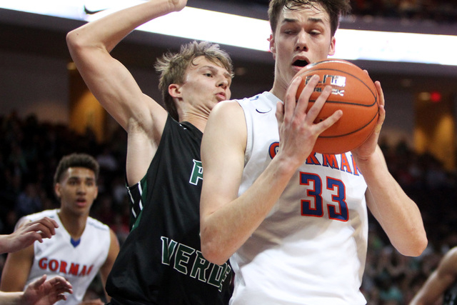 Bishop Gorman center Stephen Zimmerman checks Palo Verde forward Grant Dressler during their ...