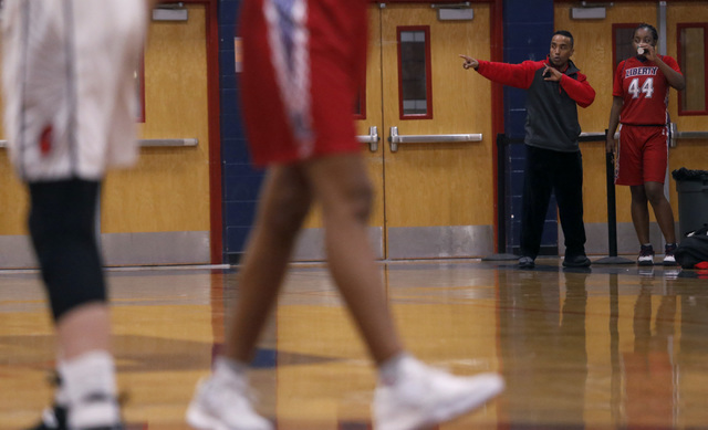 Liberty junior Dre’una Edwards (44) listens to a coach during a basketball game on Tue ...