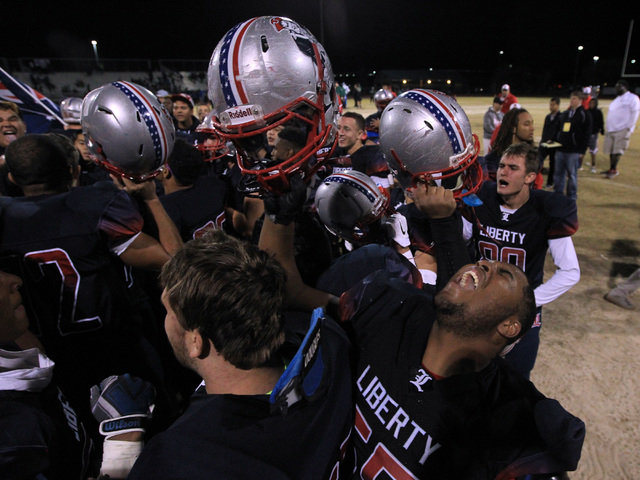 Liberty players celebrate a 28-14 win over Green Valley in the Sunrise Region quarterfinals. ...