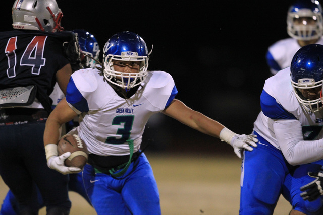 Green Valley running back Brenan Adams finds a hole in the Liberty defense on Friday. Libert ...