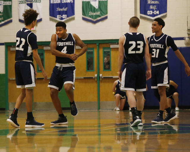 Foothill’s Mauricio Smith (4) has fun as Foothill’s Marvin Coleman (31) watches ...