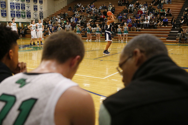 A coach speaks to Foothill’s Hunter Hitchcock (31) after he fouled Foothill’s Ma ...