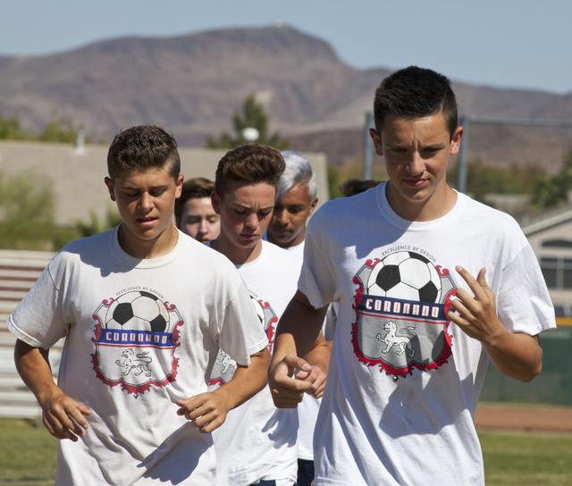 Preston Judd, right and his soccer teammates run drills at Coronado High School on Tuesday, ...