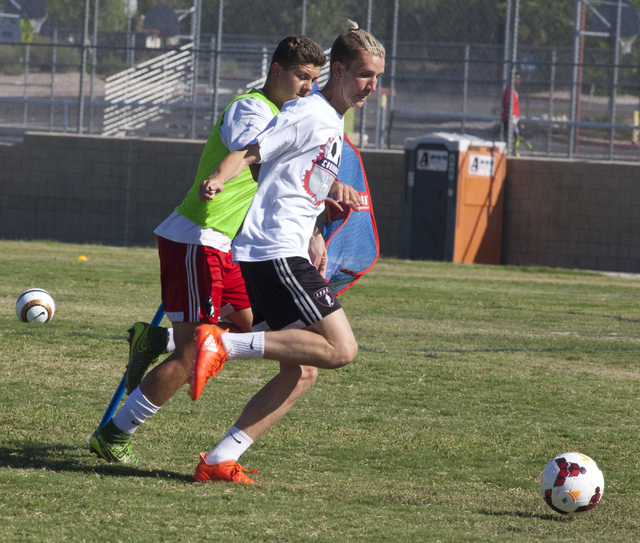 John Lynam, right, runs drills with his soccer teammate at Coronado High School on Tuesday, ...