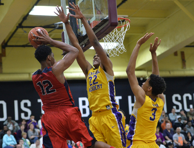 Findlay Prep Pilots junior Justin Jackson (12) tries to shoot the ball over Montverde Academ ...