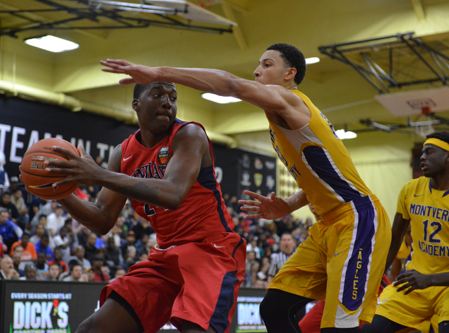 Findlay Prep Pilots junior Khalea Turner (24) passes the ball around Montverde Academy Eagle ...