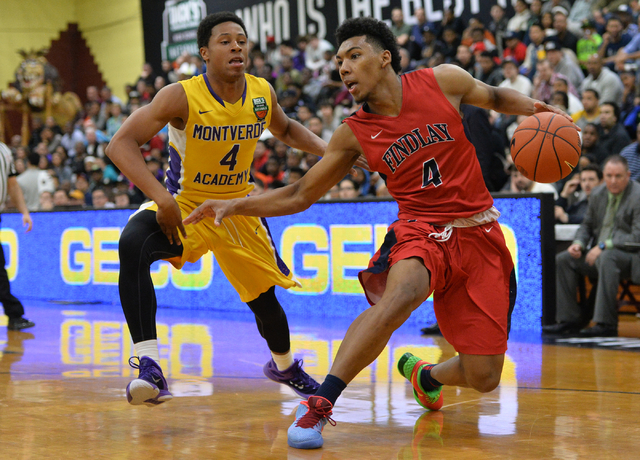 Findlay Prep Pilots senior Allonzo Trier (4) dribbles the ball around Montverde Academy Eagl ...