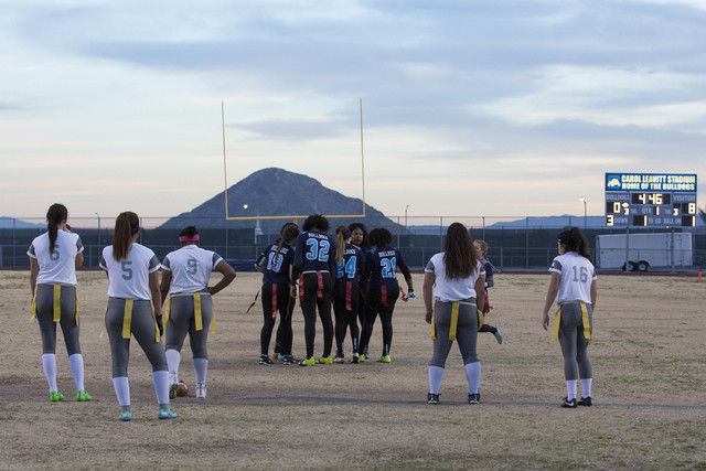 Centennial flag football team huddles before a play against Cimarron-Memorial at Centennial ...