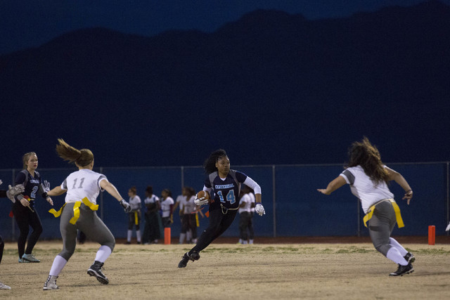 Centennial senior LeNae Thomas runs the ball during a game against Cimarron-Memorial at Cent ...