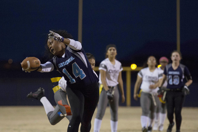 Centennial senior LeNae Thomas gets attempts to run the ball, but tagged by Cimarron-Memoria ...