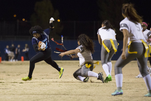 Centennial senior Chantay Dixon attempts to run the ball during a game against Cimarron-Memo ...