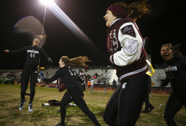 Cimarron-Memorial players, including Tiarra Del Rosario (44) and Alyssa Karpinski (17), cele ...