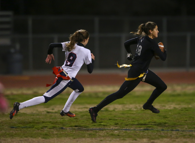 Cimarron-Memorial’s Haylei Hughes (18) runs for the end zone past Coronado’s Cai ...