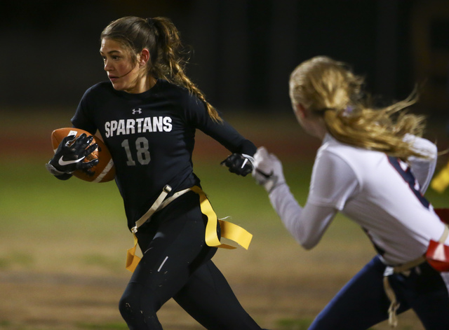 Cimarron-Memorial’s Haylei Hughes (18) runs the ball against Coronado during the Class ...