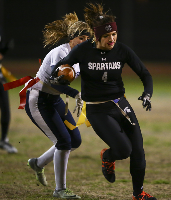 Cimarron-Memorial’s Logan DeLong (4) is tagged out by Coronado’s Shawna Slater ( ...