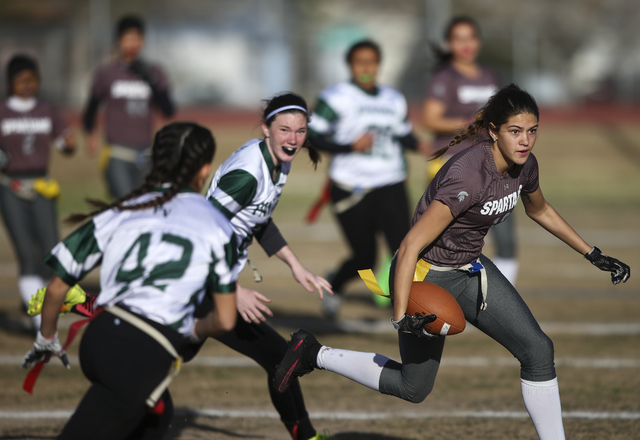 Cimarron-Memorial’s Haylie Hughes (18) runs the ball against Palo Verde during the Sun ...